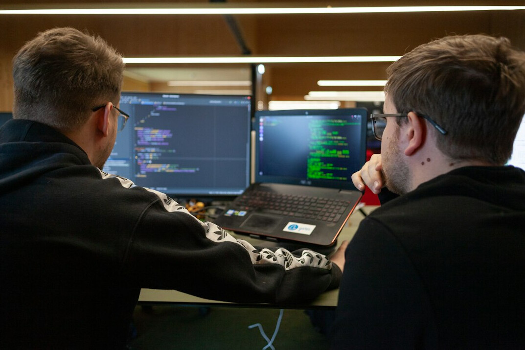 team of developers discussing code